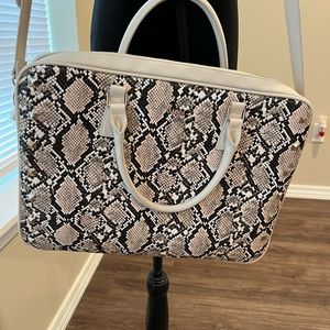 Brand new White House, Black market/ handbag, or laptop case.